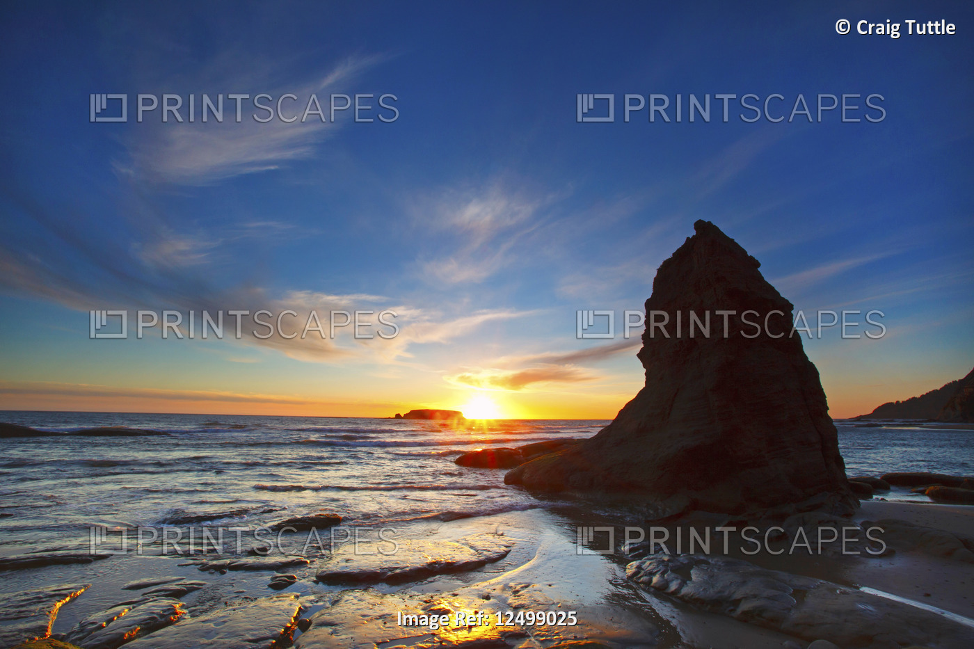 sunset over rock formation at Otter Rock Beach, Oregon Coast, Pacific Northwest.